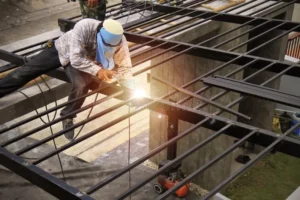 laborers-making-steel-roofs-painted-black-laborers-making-steel-roofs-painted-black-modern-industrial-style-garage-132851342